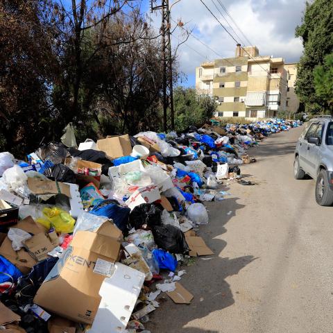 BEIRUT, LEBANON - JULY 25: Before and after photos of Lebanese garbage crisis show rubbish bags piled up on the side of the road  and the road after the garbages removed, in Hazmiyah, east of Beirut, Lebanon on July 25, 2017.

 (Photo by Ratib Al Safadi/Anadolu Agency/Getty Images)