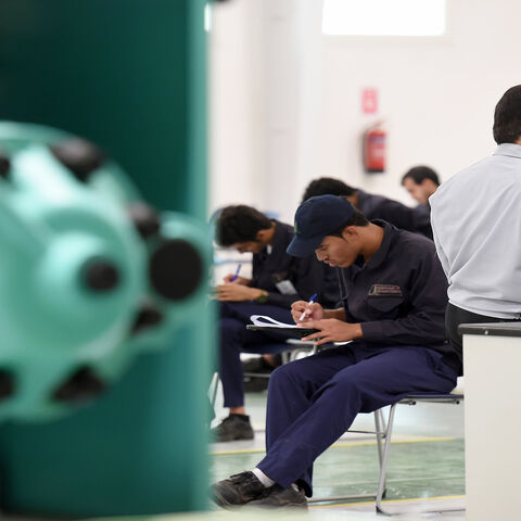 Saudi students pass their final exams at a workshop in the Higher Institute for Plastics Fabrication on June 13, 2016 in Riyadh. 
The students at the Higher Institute for Plastics Fabrication (HIPF) learn to manufacture plastic bags, pipes, bottles and other products, skills they immediately put to work in what the government says is a unique model. Reducing the kingdom's high unemployment rate is a foundation -- and major challenge -- of the government's wide-ranging Vision 2030 reform plan unveiled in Apr