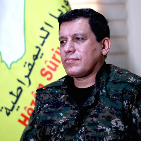 Mazloum Abdi (Kobani), commander-in-chief of the Syrian Democratic Forces (SDF), speaks with AFP during an interview in the countryside outside the northwestern Syrian city of Hasakah, in the province of the same name, on January 24, 2019. - Any deal between Syria's Kurds and the Damascus regime should respect the "special status" of Kurdish-led forces who fought the Islamic State (IS) group, Kobani said. The SDF control around a third of Syria after expelling jihadists from a large northeastern swathe of t