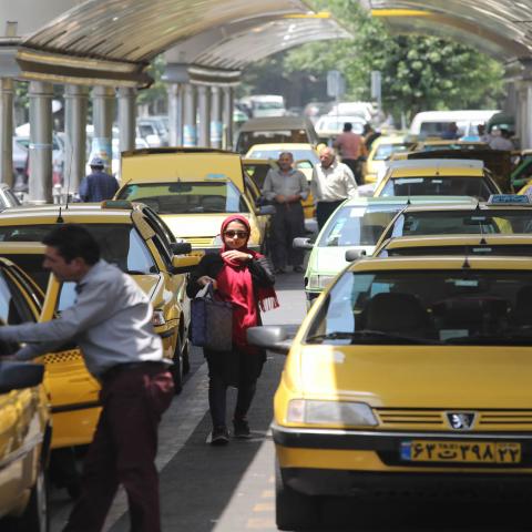 Taxis line up to pick up customers at a taxi station in the Iranian capital Tehran on July 3, 2019. - The Iranian economy is struggling in part because of the crippling US sanctions targeting Iran's oil sales, banking transactions and major industries like steel and petrochemicals. (Photo by ATTA KENARE / AFP)        (Photo credit should read ATTA KENARE/AFP via Getty Images)
