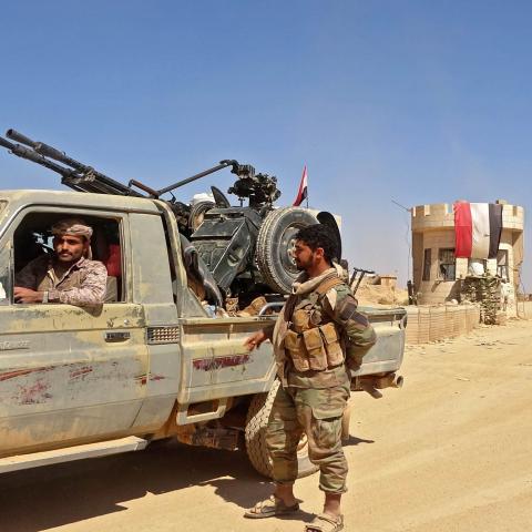 A fighter sits in a "technical" (pickup truck mounted with turret) as forces loyal to Yemen's Saudi-backed government clash with Huthi rebel fighters around the strategic government-held "Mas Camp" military base, in al-Jadaan area about 50 kilometres northwest of Marib in central Yemen, on November 22, 2020. - Marib has been the scene of intense fighting in recent months as the Huthis try to seize control of the oil-rich province -- the government's last northern stronghold. (Photo by - / AFP) (Photo by -/A