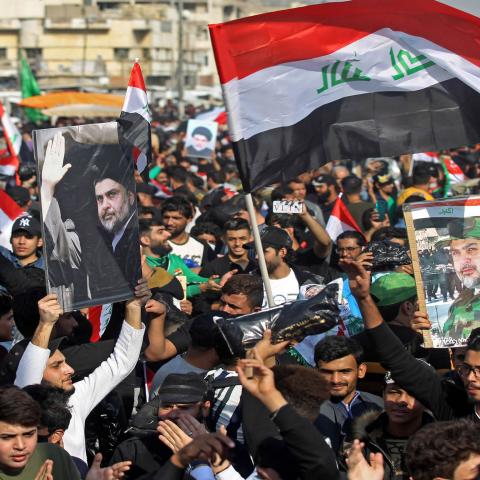 Supporters of Iraq's Shiite cleric Moqtada al-Sadr demonstrate in Tahrir Square in Baghdad on November 27, 2020. - Tens of thousands of supporters of the Shiite cleric Moqtada al-Sadr gathered in the Iraqi capital in a show of political power, as the legislative elections are scheduled for next June. (Photo by Ahmad AL-RUBAYE / AFP) (Photo by AHMAD AL-RUBAYE/AFP via Getty Images)