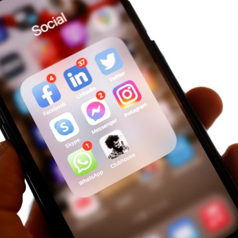 An illustration photo taken on January 25, 2021 shows the application Clubhouse on a smartphone in Berlin, after Thuringia's state premier Bodo Ramelow admitted on the chat app to playing Candy Crush on his phone during online pandemic response meetings with German Chancellor Angela Merkel. - Bodo Ramelow, head of the eastern Thuringia state, made the confession during what he thought was a closed meeting on the invitation-only audio chatroom app Clubhouse at the weekend. (Photo by Odd ANDERSEN / AFP) (Phot