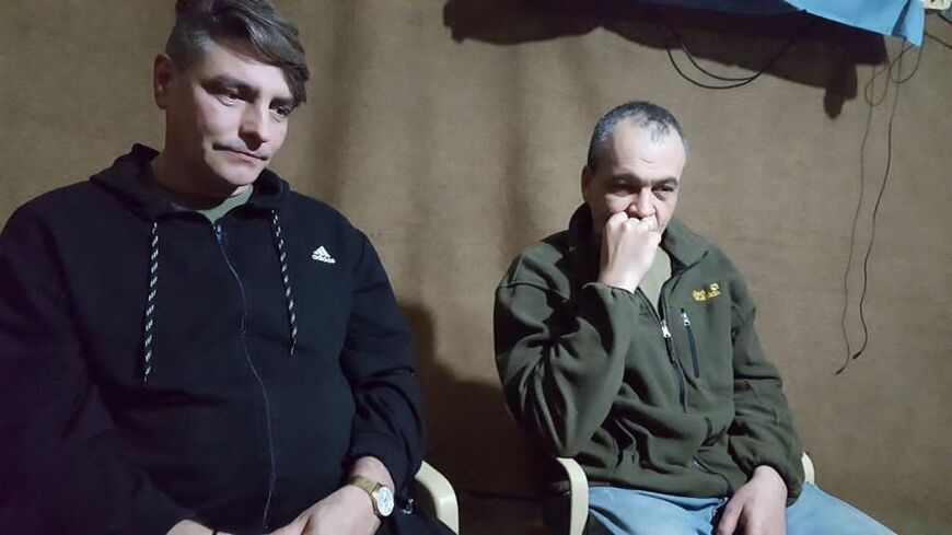 Still from a proof of life video shot  June 3 2018 by the PKK showing Yevgeny Fomenko and Alexander Sanpiter 