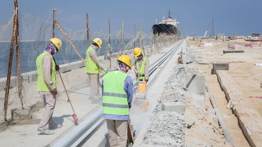 A group of foreign workers on duty at Duqm Port, in Oman’s central eastern seaboard