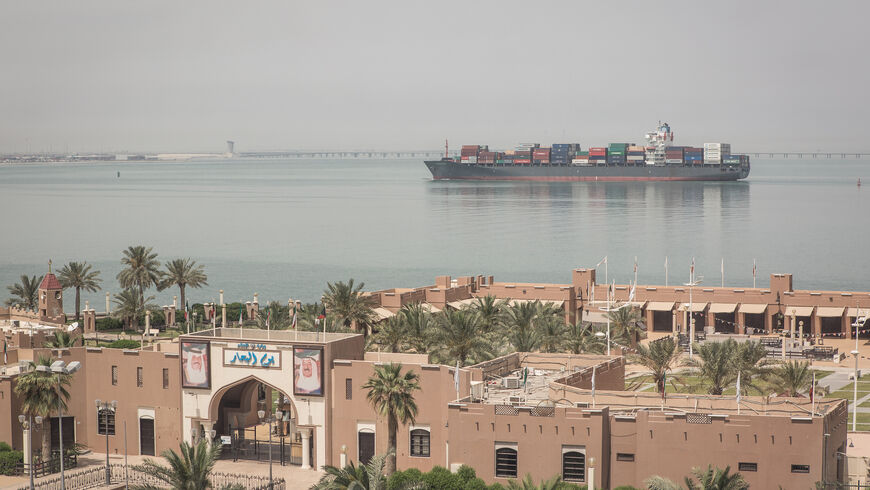 A cargo container ship heads towards Shuwaikh port, Kuwait’s main commercial port.