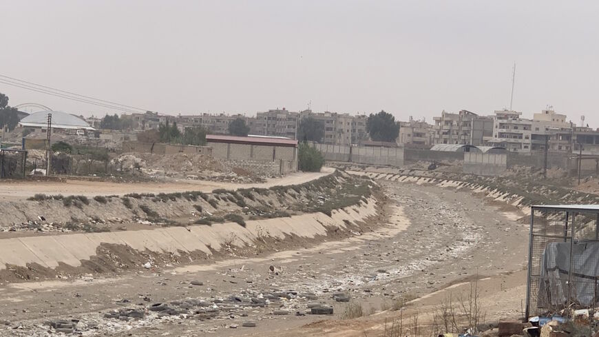 The dry riverbed of the Khabur is seen in al-Hasakah, Nov. 1, 2021. (Amberin Zaman/Al-Monitor)