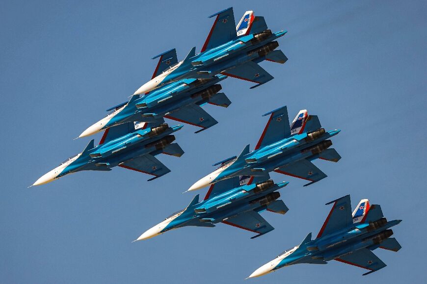 The Russian air force aerobatic team known as the Russian Knights take part in the Dubai air show in November 2021
