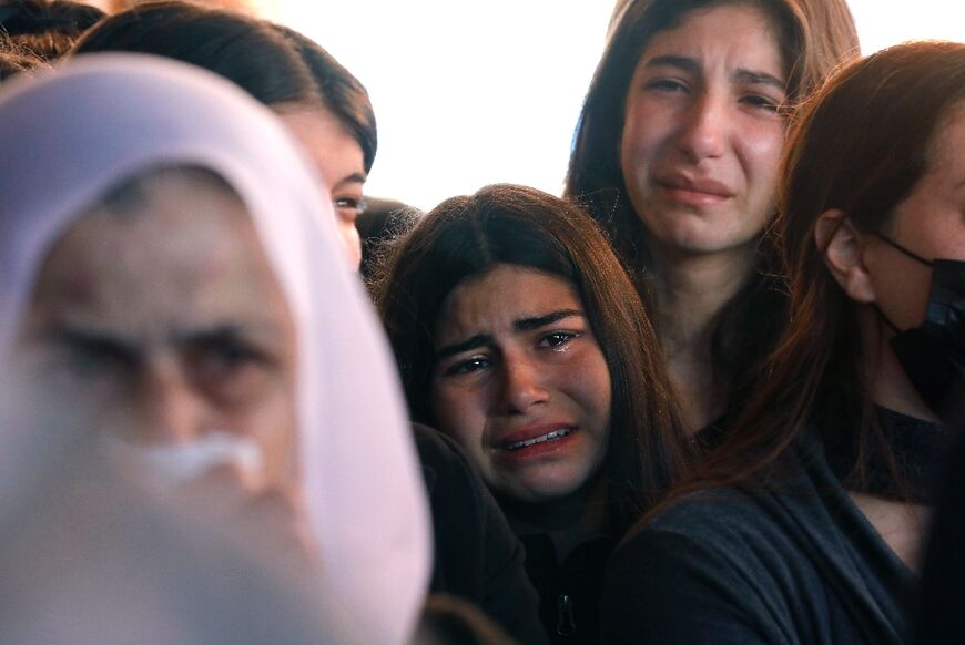 Family and friends mourn Israeli border police officer Yezen Falah, in the Druze village of Kisra-Sumei, on March 28, 2022. Two police offers were shot dead the previous day in an attack claimed by the Islamic State group