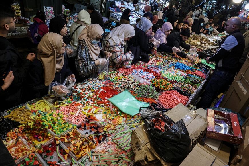 Palestinians shop for sweets in the old city of Jerusalem as they prepare for the start of the Muslim holy fasting month of Ramadan