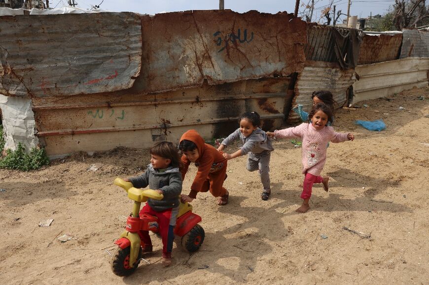 Palestinian children play in Beit Lahia in the northern Gaza Strip, on February 20, 2022