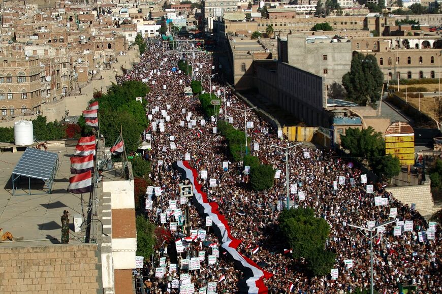 Huthi supporters take to the streets of Yemen's capital Sanaa to demonstrate against a deadly air strike against a prison in January this year