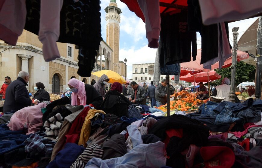 Tunisians shop at Halfaouine market near central Tunis on February 15, 2022, as the small North African country is  mired in a deep recession