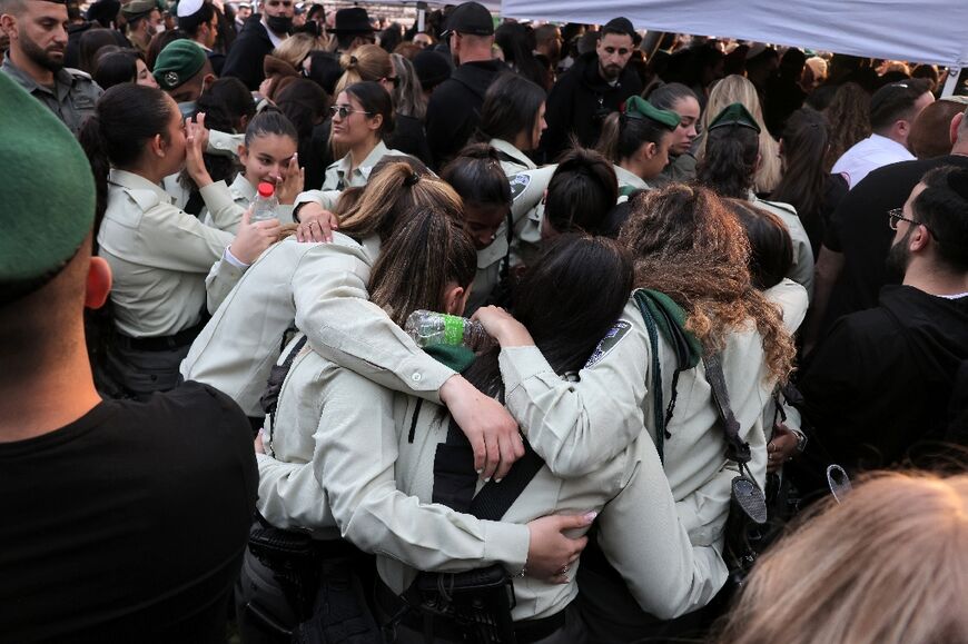 Colleagues mourn during the funeral of Israeli border police officer Shirel Aboukrat, killed in Hadera, in the Mediterranean coastal city of Netanya on March 28, 2022