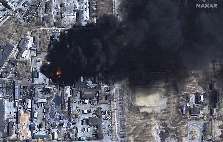 Burning oil storage tanks in an industrial area of Chernihiv, Ukraine on March 21, 2022, seen in a satellite image released by Maxar Technologies