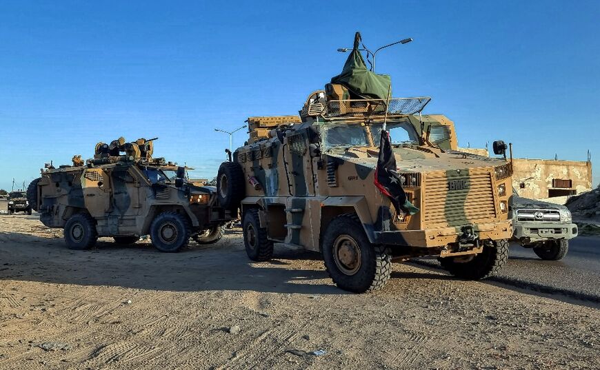 Military forces loyal to the Libyan unity government headed by Abdulhamid Dbeibah arrive from neighbouring towns in the capital Tripoli on February 12, 2022