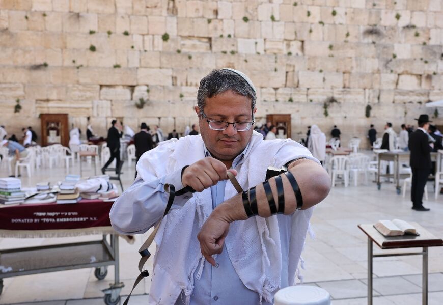 Israeli far-right lawmaker Itamar Ben-Gvir prays at the Western Wall in Jerusalem's Old City on March 31, 2022 after a visit to the Al-Aqsa compound