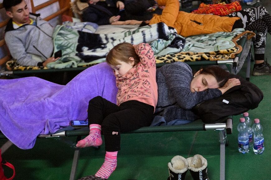 A Ukrainian woman and child at a temporary refugee centre in a primary school in Tiszabecs, eastern Hungary 