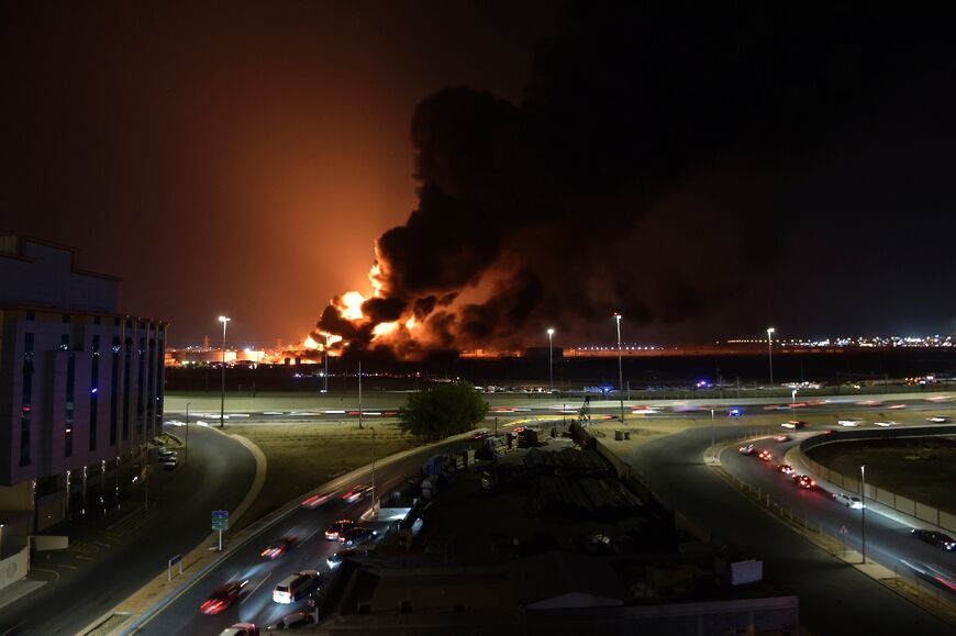Smoke and flames rise from a Saudi Aramco oil facility in the Red Sea coastal city of Jeddah on March 25 near a Formula One track following an attack by Yemen rebels