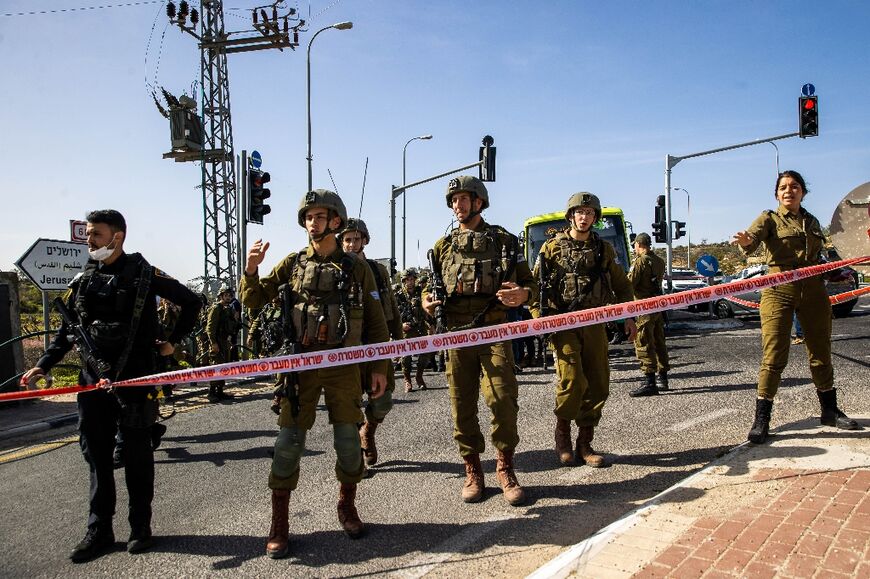 Israeli security forces near the scene of a stabbing attack on a bus near the Elazar settlement in the occupied West Bank on Thursday