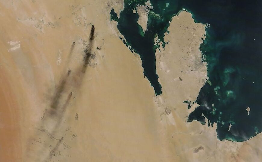 A satellite image provided by NASA Worldview on September 14, 2019 shows the aftermath of a Huthi drone strike on an oil installation owned by Saudi Aramco, in eastern Saudi Arabia