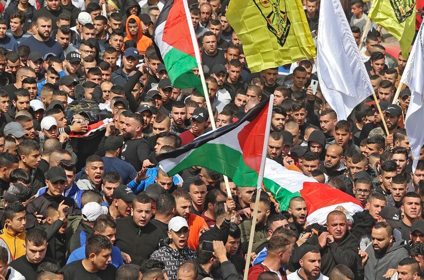 Palestinian mourners attend the funeral of Sanad Abu Atiyeh and Yazid al-Saadi in the town of Jenin