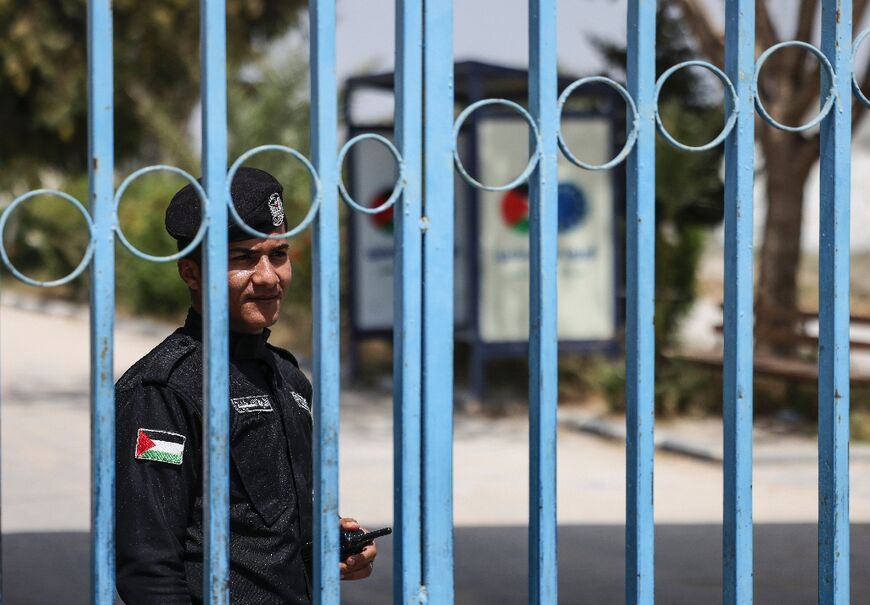 A policeman stands guard on the Palestinian side of the closed Erez border crossing between the Gaza Strip and Israel