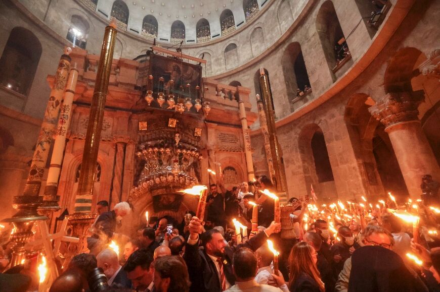 Thick orange flames danced inside the church, Christianity's holiest site