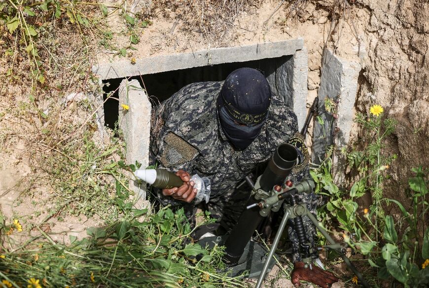 A member of the Palestinian Islamic Jihad militant group sets up a mortar in a tunnel in the Gaza Strip