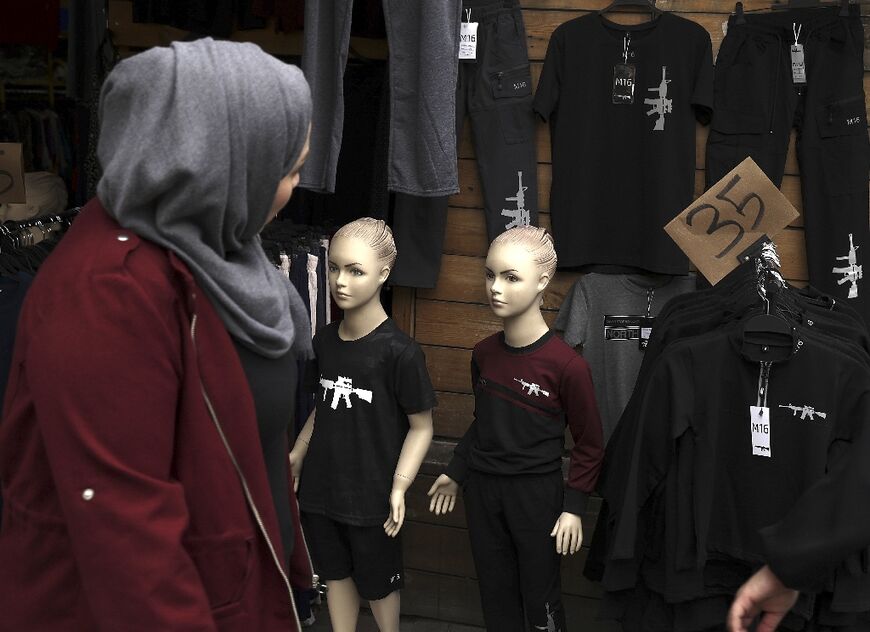 The T-shirts, which carry no party flags or emblems, are available in all sizes, including children's