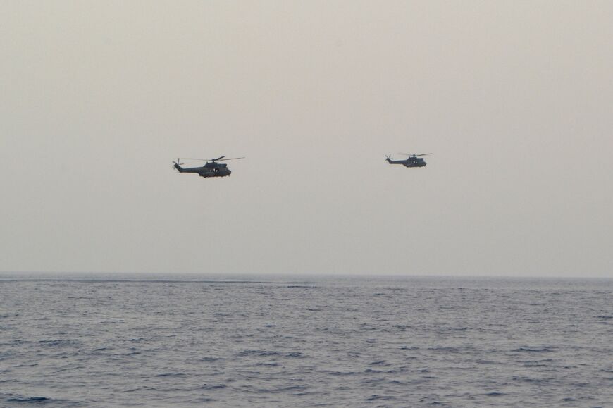 Lebanese army helicopters carry out search operations off the coast of the northern port city of Tripoli where a migrant boat capsized