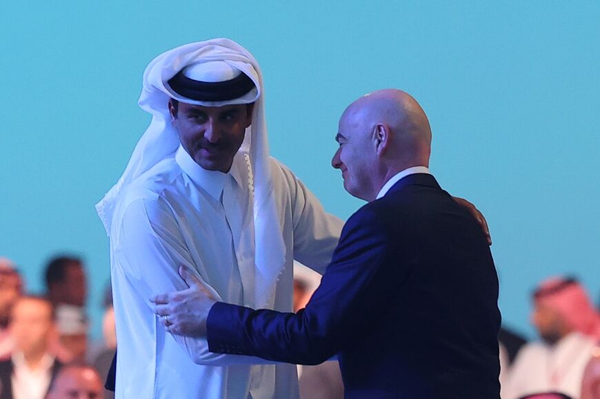 Qatar's Emir Sheikh Tamim bin Hamad al-Thani with FIFA President Gianni Infantino