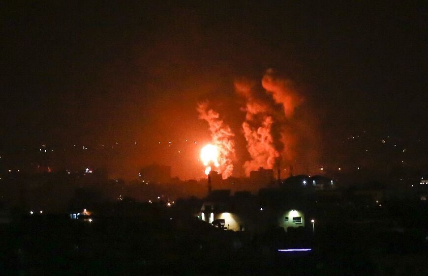 Flames and smoke rise over the central Gaza Strip as Israeli warplanes retaliate against rocket fire into southern Israel in the biggest escalation in months