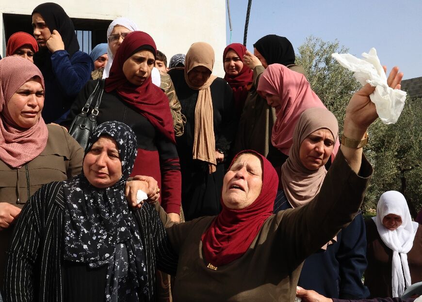 Palestinian women mourn Ghada Ibrahim Sabatien, a widowed mother of six, who was shot and killed by Israeli soldiers after she failed to stop following warning shots near Bethlehem