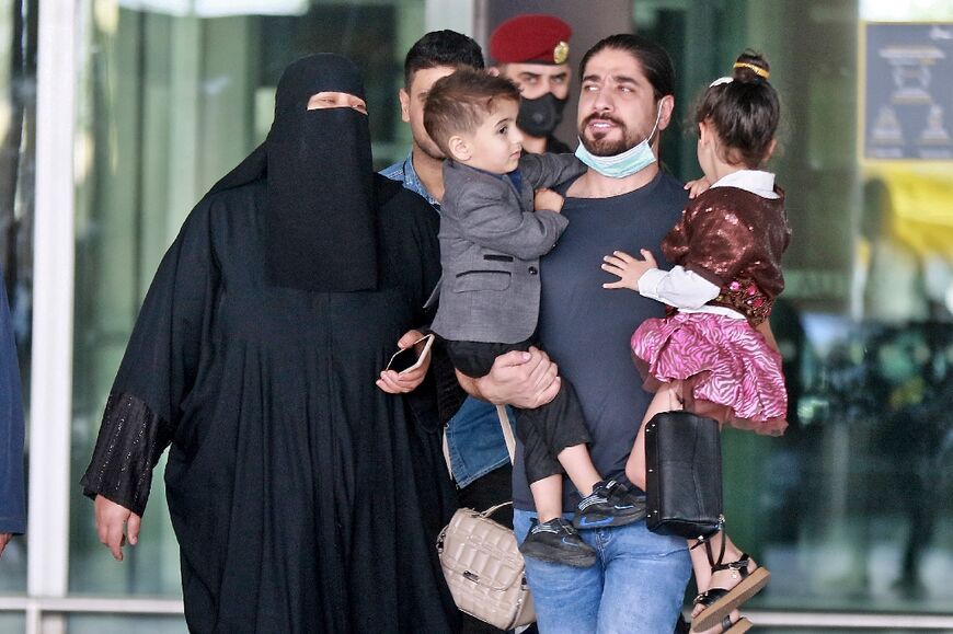 Yemeni passengers leave the Queen Alia Airport after their arrival to the Jordanian capital Amman on May 16, 2022, on the first commercial flight in nearly six years from Yemen`s rebel-held capital Sanaa