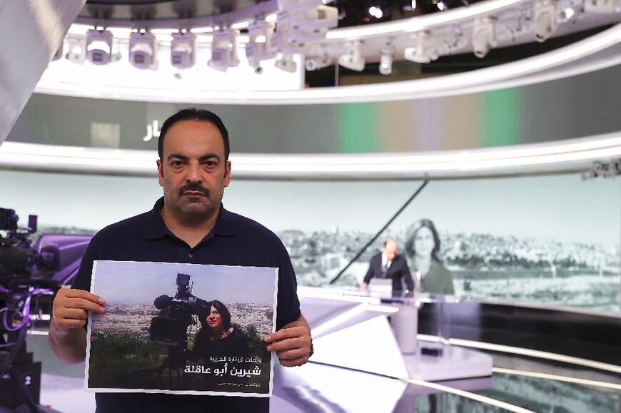 Al Jazeera journalist Haitham Abu Saleh pays tribute to Abu Akleh at the pan-Arab broadcaster's Doha headquarters