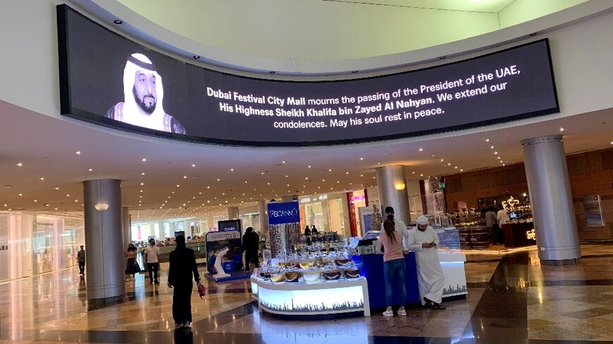 A screen displays the portrait of late UAE President Sheikh Khalifa at a mall in the emirate of Dubai during a mourning period