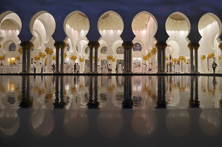 Emirati men in traditional dress attended sombre funeral prayers at Abu Dhabi's enormous, white-marble Sheikh Zayed Grand Mosque, where the imam's voice brimmed with emotion over the loudspeaker