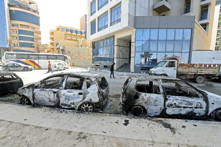 Vehicles in Libya's capital Tripoli were destroyed during fighting between forces loyal to Prime Minister Abdulhamid Dbeibah and rival forces of the Tobruk-based government on May 17, 2022 