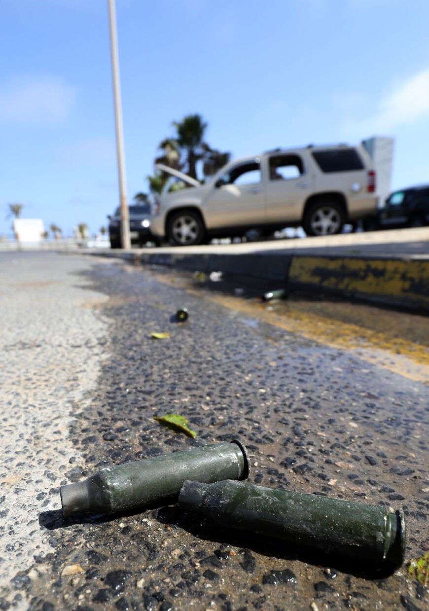 Bullet casings lie on the road after fighting between forces loyal to the Tripoli-based Prime Minister Abdulhamid Dbeibah and rival forces of the Tobruk-based government