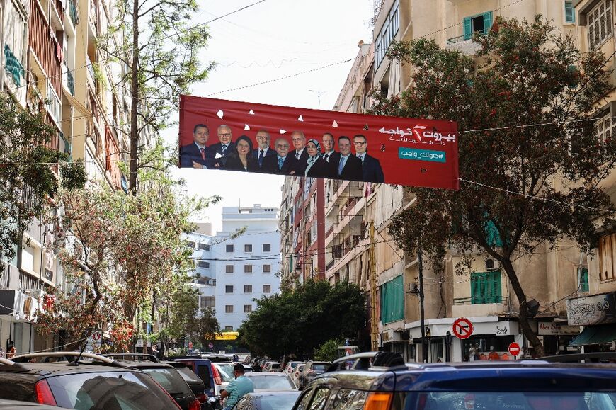An election banner hangs between buildings in the Tariq al-Jdideh neighbourhood of the Lebanese capital Beirut