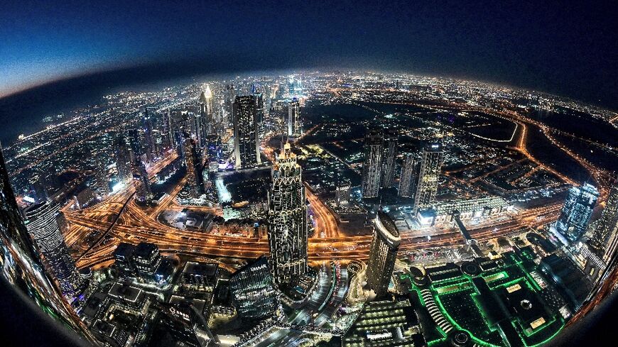 The Dubai city skyline as seen from the Burj Khalifa, currently the world's tallest building, through a fish-eye lens, on May 9, 2021