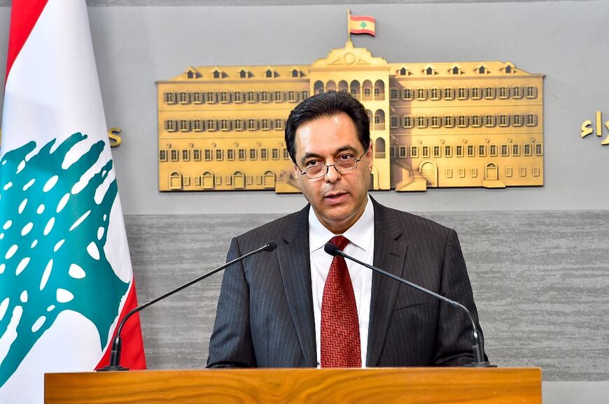 Lebanon's then prime minister Hassan Diab delivering a statement at the presidential palace in Baabda, east of the capital Beirut, on April 30, 2020