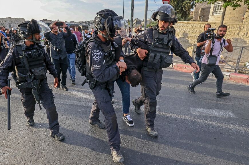 Israeli security forces detain a Palestinian during a protest condemning the death of Shireen Abu Akleh