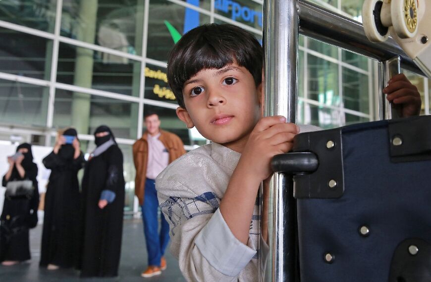Yemeni passengers leave the Queen Alia Airport following their arrival to the Jordanian capital Amman on May 16 