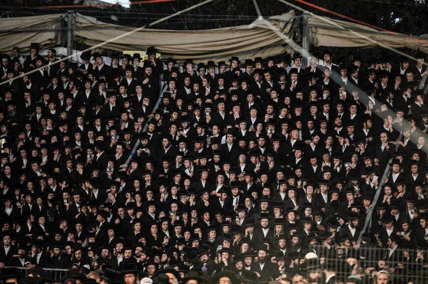 Ultra-Orthodox Jews gather at Israel's Mount Meron for last year's fateful pilgrimage to the grave of a revered rabbi in which 45 people were crushed to death in a stampede