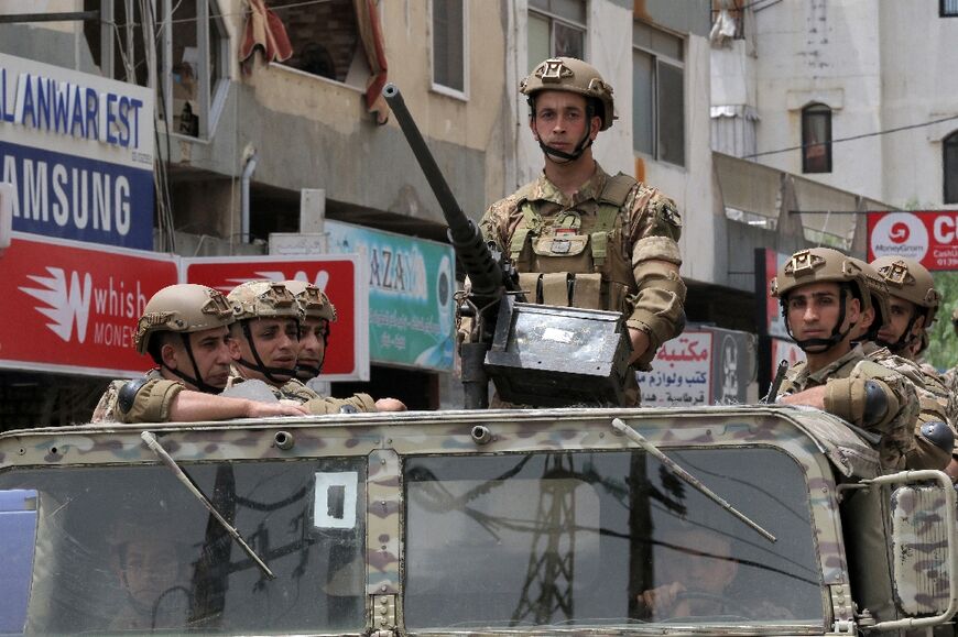 A Lebanese soldier mans the turret of am armoured car in the southern city of Nabatiyeh on May 15