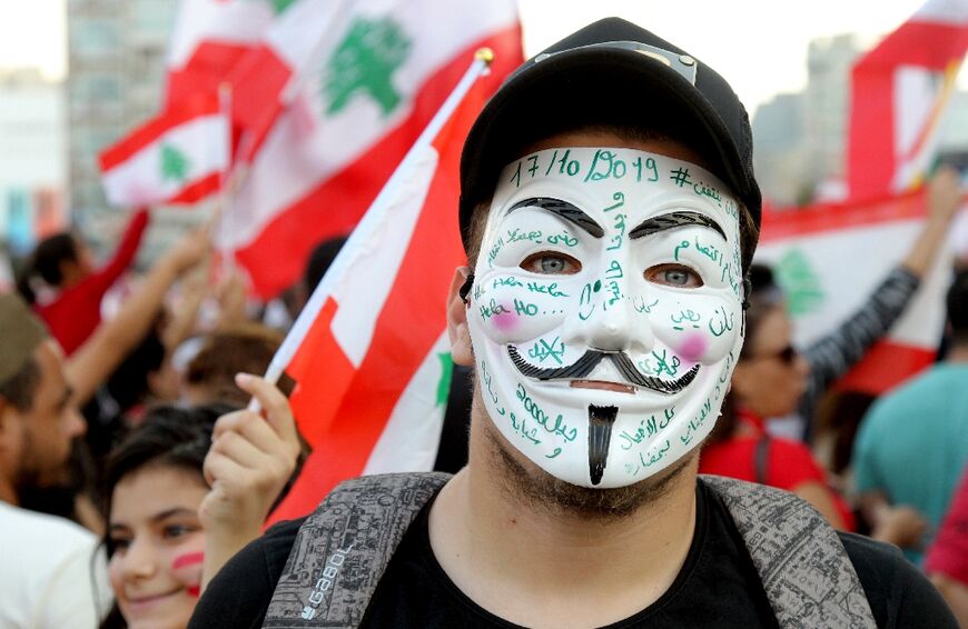 Protestors demand better living conditions and the ouster of a cast of politicians who have monopolised power and influence for decades, on October 22, 2019 in Beirut