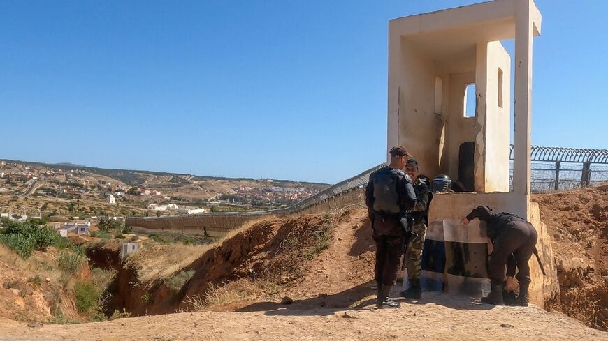 Moroccan guards man a watchtower on the heavily fortified border with the Spanish enclave of Melilla border a day after 18 African migrants died in an attempt to storm it