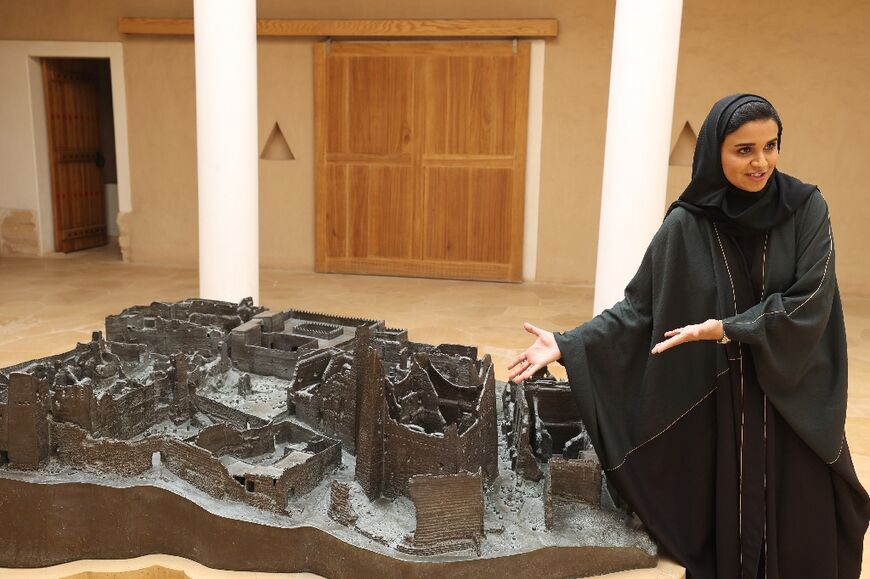 Alfuraih displays a model of the site, the birthplace of the Saudi Arabian state